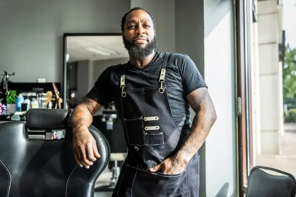 Man with a Tilt Credit Card overlay showing a $2,000 limit.