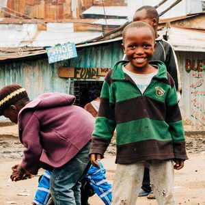 Young boys playing on a dusty street