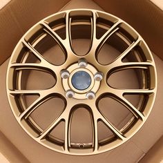 an open cardboard box with a wheel on the inside and bottom part of it's rim