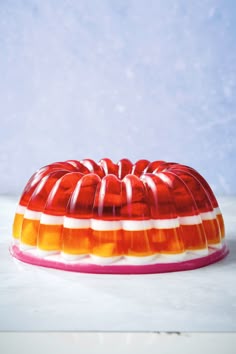 a red and orange cake sitting on top of a table