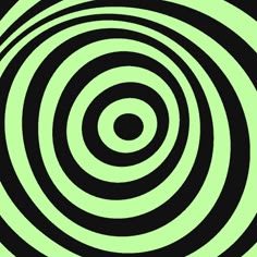 an abstract black and green background with circles in the center, forming a spiral pattern