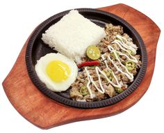 a wooden plate with rice, meat and an egg on it