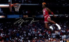 an autographed basketball player jumping in the air
