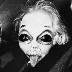 an old man with big eyes sticking out his tongue