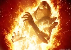 an image of a woman in flames with her arms spread out to the side and hands outstretched