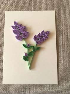 a card with paper flowers on it