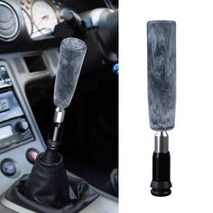 the inside of a car with a steering wheel and an air vent on top of it