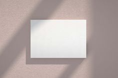 an empty square piece of paper on a wall