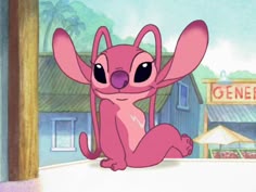 a pink cartoon character sitting on top of a white wall next to a sign that says general