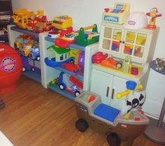 there are many toys on the floor in this room