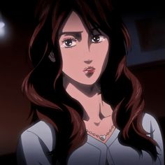 a woman with long brown hair standing in front of a window