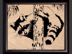a wood carving of a raccoon on a tree