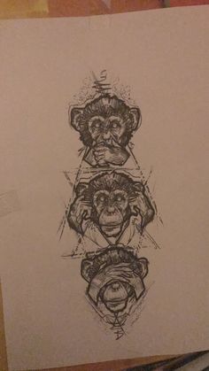 a drawing of three monkeys on paper