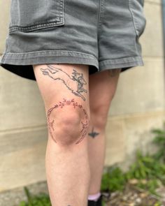 a person with a tattoo on their leg