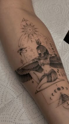 a woman's arm with an angel tattoo on it