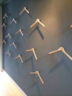 there are many clothes hangers on the wall