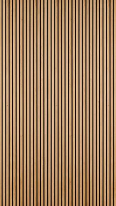 a brown and black striped wallpaper with vertical lines on the bottom half of it