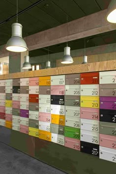 a wall covered in lots of different colored papers