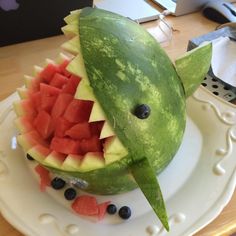 a watermelon shaped like a shark with its mouth open