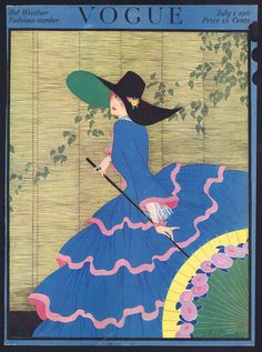 a woman in a blue dress and black hat with an umbrella on the cover of a magazine