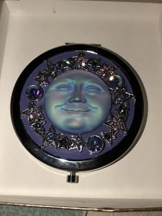 a mirror with a face on it in a box