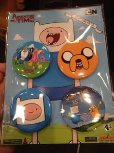 the adventure time button set is in its package