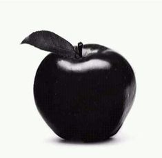 an apple with a leaf on it is shown in this black and white photo,