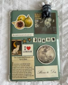 an assortment of stickers and magnets on a bed