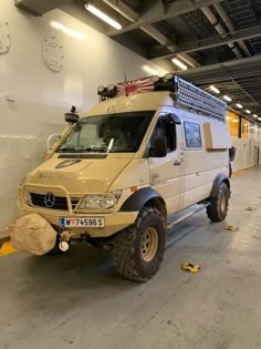 an off - road vehicle is parked in the garage