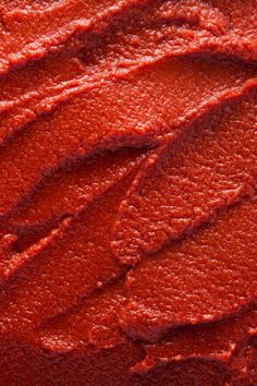 closeup of red food coloring on the surface