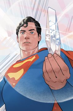 a man holding a knife in his right hand and wearing a superman suit on the left