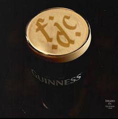 a guinness glass with the word guinness printed on it