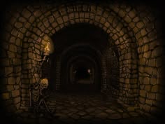 a skeleton sitting in the middle of a tunnel with a light on it's head