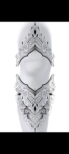 an artistic white vase with intricate designs on it's sides and the bottom part of its body