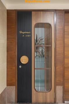 the front door to an apartment building with wood paneling and metal bars on it