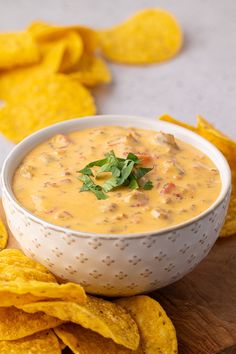 a bowl of quesadilla dip with tortilla chips on the side
