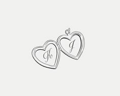 two heart shaped lockes with initials on them