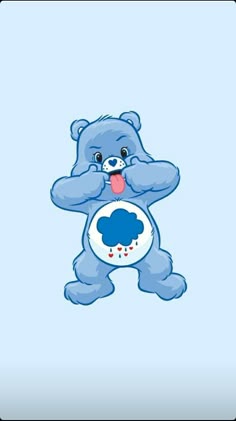 a blue teddy bear with its tongue out and eyes wide open, standing in the air