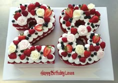 the number 50 is made up of strawberries and blueberries with white flowers on top