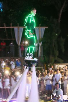 a man riding a skateboard on top of a fire hydrant in front of a crowd