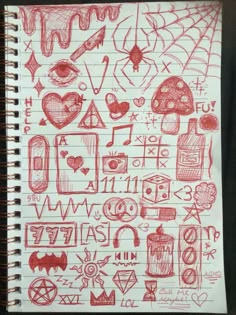 a notebook with some drawings on it and writing in red marker pens next to each other