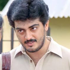 the man is looking at the woman in front of him