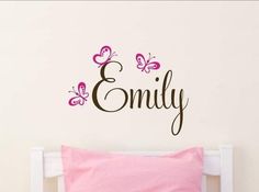 a wall decal with butterflies and the word'embly '