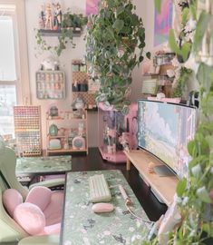 a living room filled with lots of furniture and plants on top of it's walls