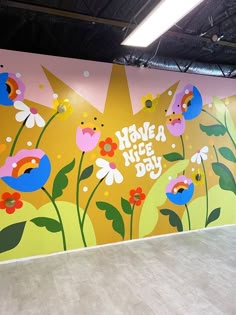 there is a mural painted on the wall in this building that says have a nice day