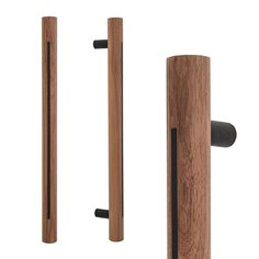 two wooden doors with black handles and one has a door handle in the same direction