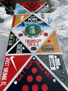 a snowboard with many different stickers on it