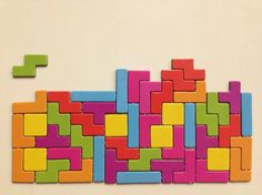colorful blocks are arranged in the shape of a puzzle