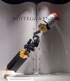 an artistic display with a giant object in the shape of a rocket