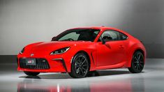 a red sports car parked in a garage
